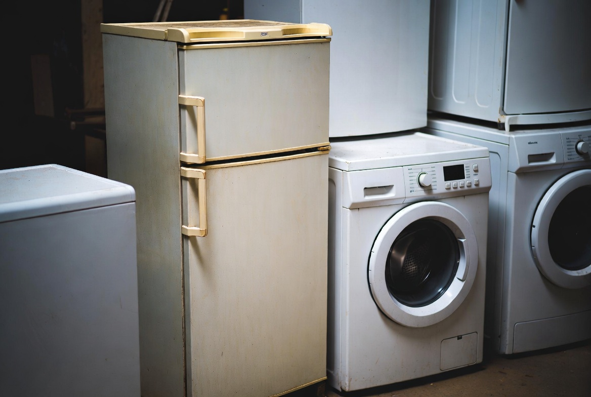 Appliance removal in Calgary — JunkMojo hauling a fridge and washer from a home